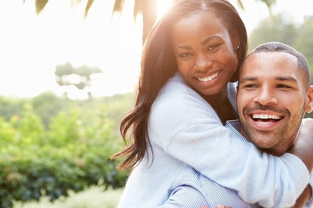 Happy couple showing affection, completely at ease with one another.