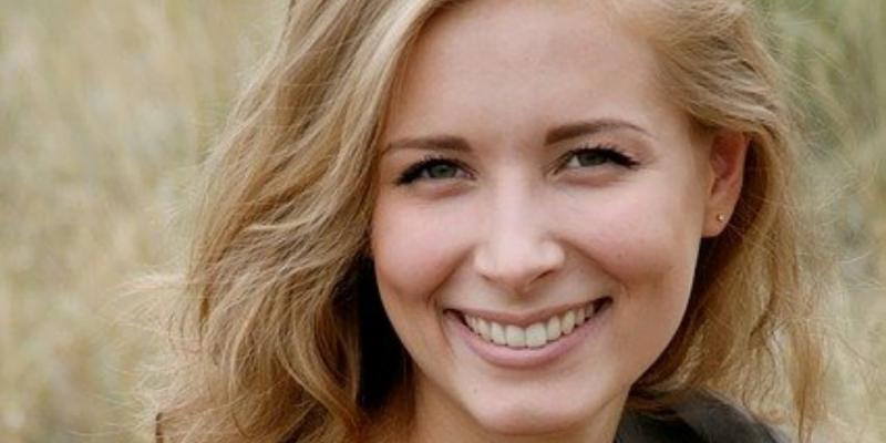 Woman smiling, learning how to be happy again.