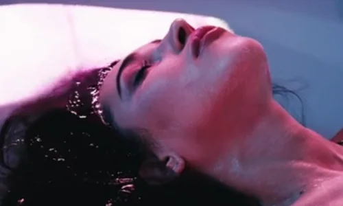 Woman, in a state of relaxing bliss, enjoying the benefits of float tank therapy.
